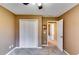 Bedroom featuring carpeted floors, a closet, and access to additional rooms in the home at 6921 Springbank Way, Stone Mountain, GA 30087