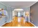 Spacious dining room with hardwood floors, elegant lighting fixture, and ample natural light at 6921 Springbank Way, Stone Mountain, GA 30087