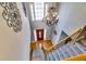 Elegant two story foyer with hardwood floor, staircase, and large chandelier at 6921 Springbank Way, Stone Mountain, GA 30087