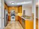 Well-lit kitchen featuring stainless steel appliances, granite countertops, and tiled backsplash at 6921 Springbank Way, Stone Mountain, GA 30087