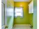 Practical laundry room featuring bright-colored walls and a window at 6921 Springbank Way, Stone Mountain, GA 30087