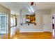 Open-concept living room showcasing hardwood floors and a view of the kitchen at 6921 Springbank Way, Stone Mountain, GA 30087