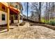 A spacious stone patio and landscaped backyard create a beautiful outdoor living space at 6921 Springbank Way, Stone Mountain, GA 30087
