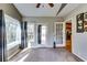 Bright sunroom with vaulted ceilings and large windows offering a peaceful view at 6921 Springbank Way, Stone Mountain, GA 30087