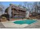 Spacious backyard with a large pool, brick patio, and multiple decks at 7985 Thunder River Way, Cumming, GA 30028