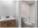 Bathroom featuring a wood vanity with a quartz countertop and a shower-tub combo at 7985 Thunder River Way, Cumming, GA 30028