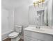 Functional bathroom includes a tub/shower combo, toilet, and single sink vanity with storage at 7985 Thunder River Way, Cumming, GA 30028
