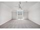 Bright, spacious bedroom featuring neutral walls, plush carpeting, and natural light at 7985 Thunder River Way, Cumming, GA 30028