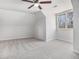 Large bedroom featuring plush carpeting, neutral walls and window to the outside at 7985 Thunder River Way, Cumming, GA 30028