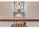 Grand foyer with hardwood floors and arched transom over the front door viewed from the top of the staircase at 1674 Summersweet Ln, Dacula, GA 30019