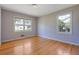 Bright bedroom featuring two large windows, providing ample natural light and hardwood floors at 2609 Colonial Dr, Atlanta, GA 30337