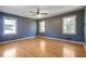 Spacious bedroom featuring hardwood floors and ample natural light from multiple windows at 2609 Colonial Dr, Atlanta, GA 30337