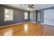 Bedroom featuring hardwood floors, a large window, and a closet for storage at 2609 Colonial Dr, Atlanta, GA 30337