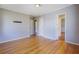 Bedroom featuring hardwood floors with several door entrances at 2609 Colonial Dr, Atlanta, GA 30337