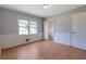Bedroom with hardwood floors, a closet, and an ensuite bathroom at 2609 Colonial Dr, Atlanta, GA 30337