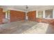 A brick carport features ample covered parking with a door to the home at 2609 Colonial Dr, Atlanta, GA 30337