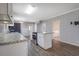 Well-lit kitchen with modern stainless-steel appliances and granite countertops at 2609 Colonial Dr, Atlanta, GA 30337