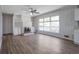 Bright living room features a brick fireplace and built-in shelving at 2609 Colonial Dr, Atlanta, GA 30337