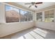 Bright sunroom with multiple windows offering abundant natural light and views at 2609 Colonial Dr, Atlanta, GA 30337
