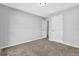 A standard-sized bedroom with neutral carpeting, awaiting your personal touch and decor at 5016 Larkspur Ln, Atlanta, GA 30349