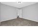 Clean bedroom with neutral carpet that provides a cozy space with a walk-in closet and an open door at 5016 Larkspur Ln, Atlanta, GA 30349
