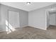 Well-lit bedroom featuring neutral carpet and closet, ready for furnishings and personalization at 5016 Larkspur Ln, Atlanta, GA 30349