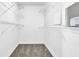 Walk-in closet features wire shelving and carpet flooring at 5016 Larkspur Ln, Atlanta, GA 30349