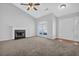 Bright living room with fireplace, ceiling fan, and ample natural light at 5016 Larkspur Ln, Atlanta, GA 30349