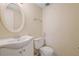 Powder room features a modern sink and toilet at 1124 Brandon Hill Way, Jonesboro, GA 30238