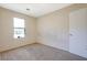Bedroom with neutral carpet and a window providing natural light over neutral carpet at 1124 Brandon Hill Way, Jonesboro, GA 30238