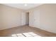 Bedroom showcasing neutral carpet and a white door leading to a closet at 1124 Brandon Hill Way, Jonesboro, GA 30238
