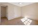 Bedroom featuring neutral carpet and white door with a ceiling fan with light at 1124 Brandon Hill Way, Jonesboro, GA 30238
