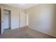 Bedroom featuring neutral carpet and a door leading to a closet at 1124 Brandon Hill Way, Jonesboro, GA 30238