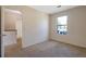 Bedroom with neutral carpet and a window providing natural light over neutral carpet at 1124 Brandon Hill Way, Jonesboro, GA 30238