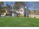 Beautiful home features a well-maintained lawn, a fenced yard, and a cozy backyard at 1124 Brandon Hill Way, Jonesboro, GA 30238