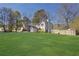 Beautiful home features a well-maintained lawn, a fenced yard, and a cozy backyard at 1124 Brandon Hill Way, Jonesboro, GA 30238