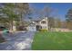 Charming two-story home features a single garage, carport, and a well-maintained lawn at 1124 Brandon Hill Way, Jonesboro, GA 30238
