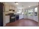 Eat-in kitchen with a bay window overlooking the yard at 1124 Brandon Hill Way, Jonesboro, GA 30238