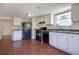 Functional kitchen with white cabinetry, modern appliances, and hard surface floors at 1124 Brandon Hill Way, Jonesboro, GA 30238
