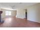 Spacious living room featuring hardwood floors, a ceiling fan, and plenty of natural light at 1124 Brandon Hill Way, Jonesboro, GA 30238