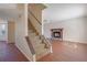Bright living room boasts hard surface floors, fireplace, and staircase access at 1124 Brandon Hill Way, Jonesboro, GA 30238