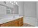 Bathroom with vanity and sink, neutral paint, tub, and tile floors at 2551 Tolliver Dr, Ellenwood, GA 30294
