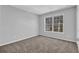 Bedroom with natural light and plush carpet at 2551 Tolliver Dr, Ellenwood, GA 30294