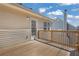 Exterior view of a wooden deck showcasing the home's architectural details at 2551 Tolliver Dr, Ellenwood, GA 30294