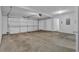 Spacious two car garage featuring an automatic door opener and interior access door at 2551 Tolliver Dr, Ellenwood, GA 30294