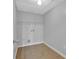 Simple laundry room with tile floors and open wire shelving at 2551 Tolliver Dr, Ellenwood, GA 30294