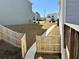Exterior view of home featuring a side yard, with a narrow walkway, new grass, and a wooden fence at 3836 Saddle Hill Way, Douglasville, GA 30135