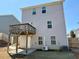 Exterior view of the home highlighting the backyard, a wooden deck, and freshly installed sod at 3836 Saddle Hill Way, Douglasville, GA 30135