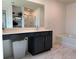 Bathroom with a vanity, a large mirror, a bathtub, and modern fixtures at 3836 Saddle Hill Way, Douglasville, GA 30135