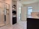 Bathroom featuring a glass-enclosed shower, vanity with marble countertops, and tile flooring at 3836 Saddle Hill Way, Douglasville, GA 30135